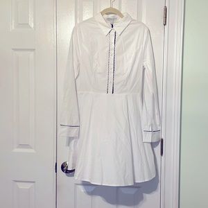 Crisp white shirtdress with black scallop trim